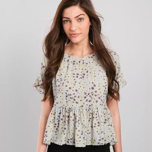Buckle Daytrip Floral Peplum Top. Size Small.